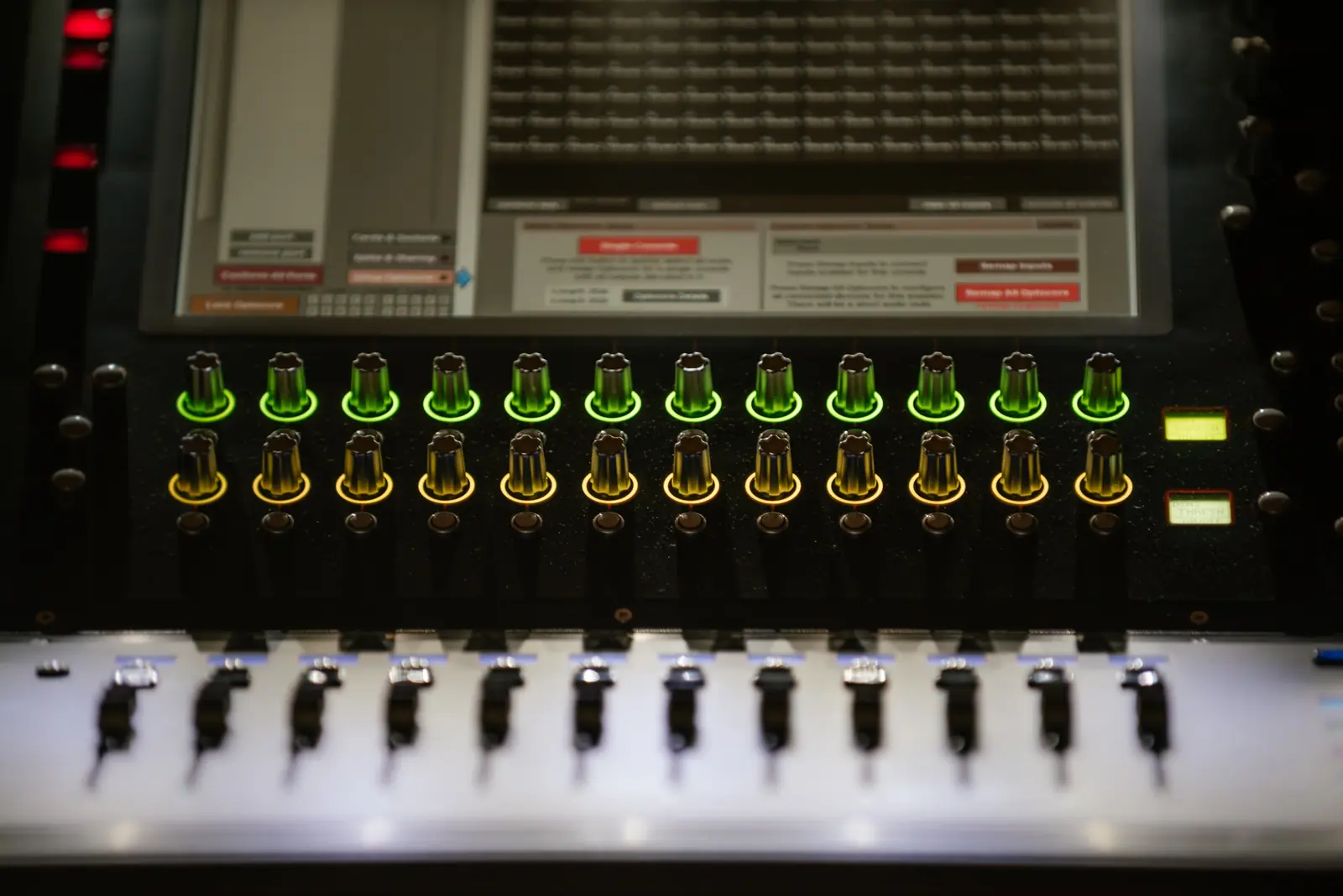 Amplifier rack with signal meters lit green and amber