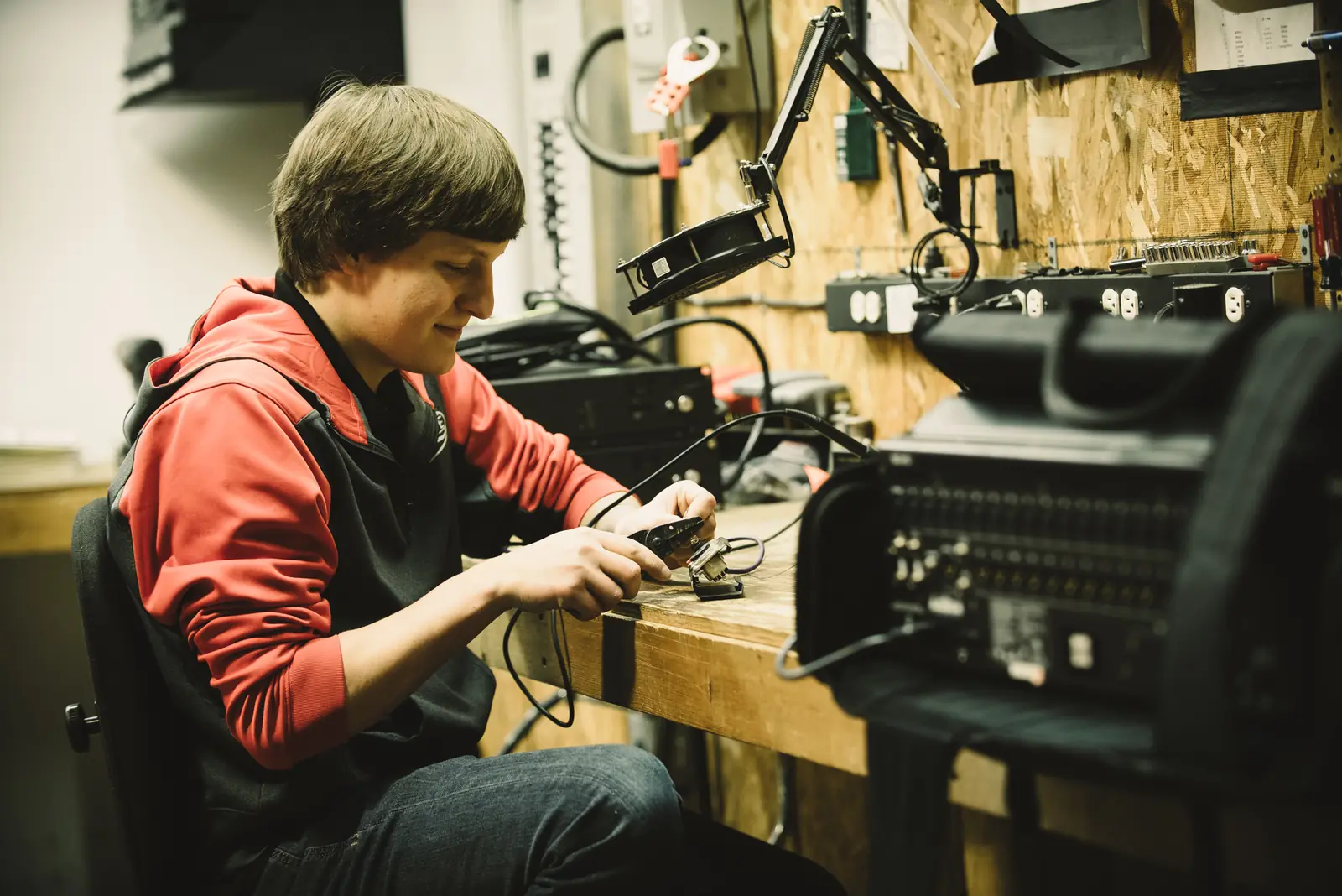 Technician servicing gear on the shop bench