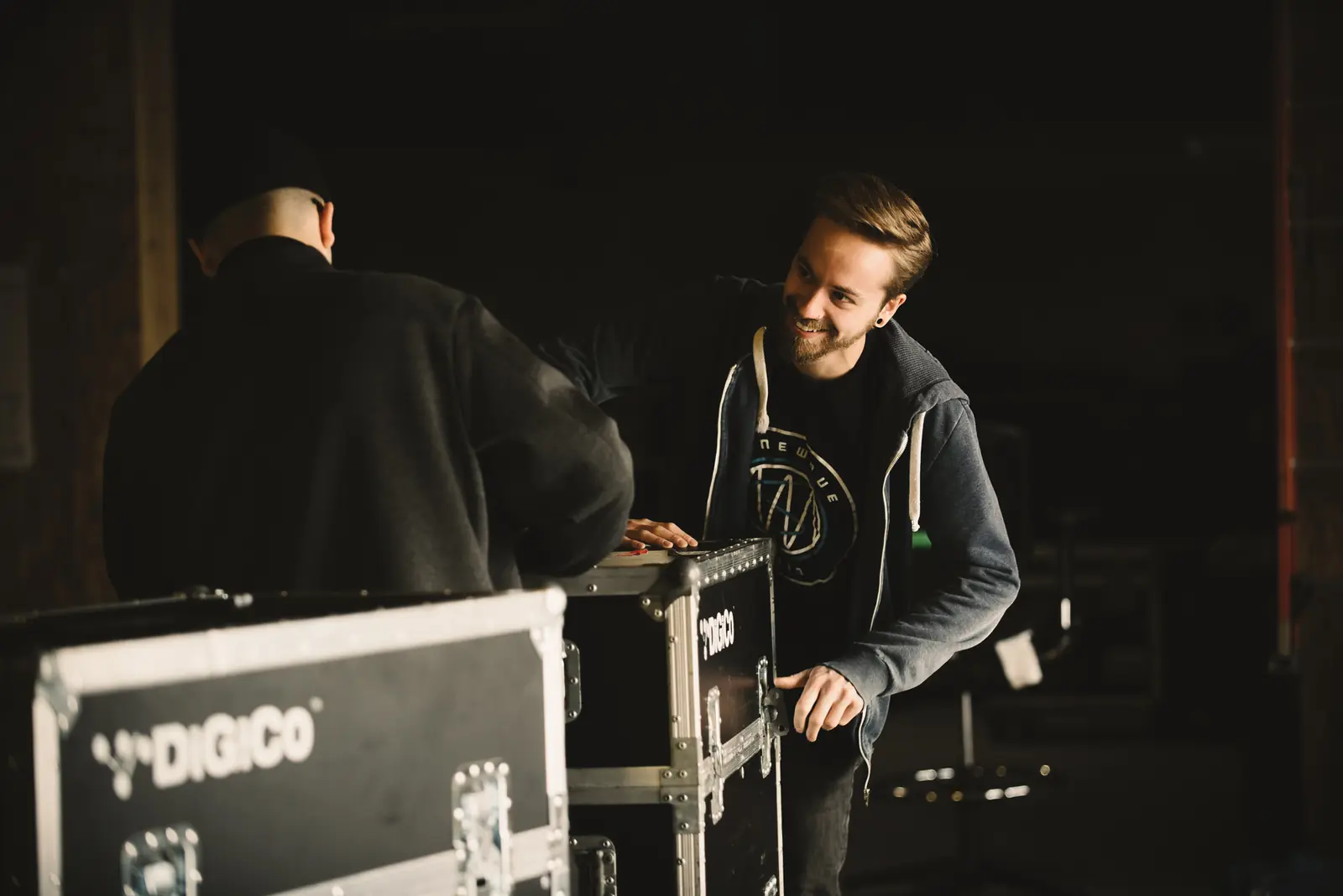 Sinewave crew prepping a DiGiCo console case