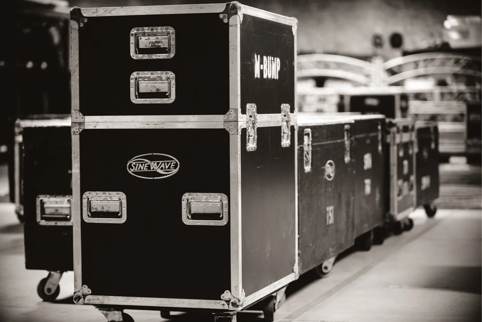 Sinewave-branded road cases staged for a show